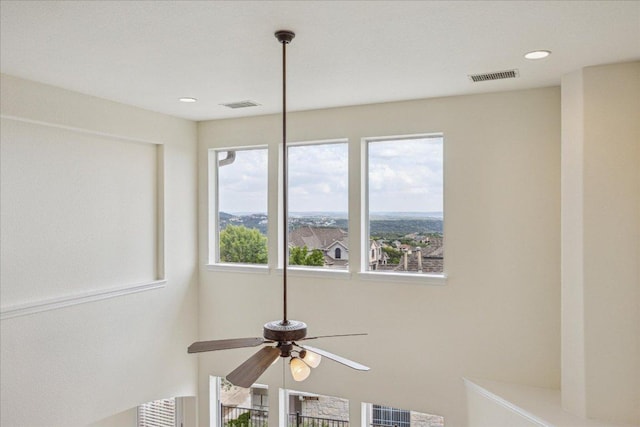 details with a ceiling fan and visible vents