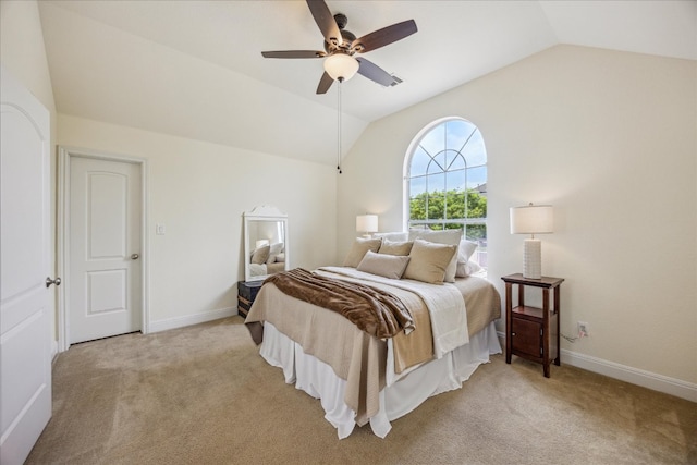 bedroom featuring baseboards, ceiling fan, light carpet, and lofted ceiling