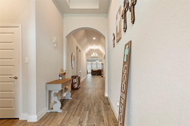 3105 High Meadow St, Seguin, TX 78155 - corridor featuring arched walkways, wood finished floors, and baseboards