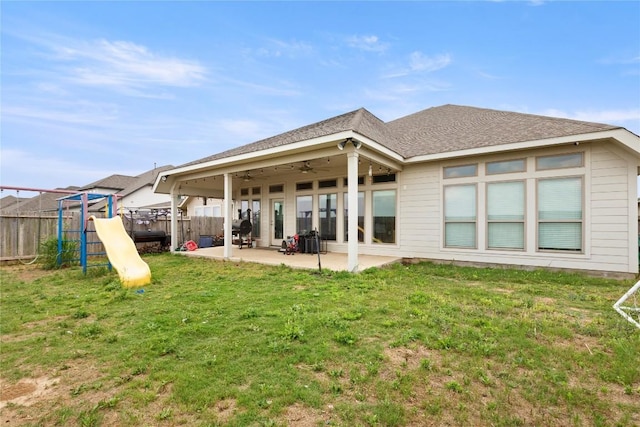 3105 High Meadow St, Seguin, TX 78155 - rear view of property featuring ceiling fan, a patio, a playground, and roof with shingles