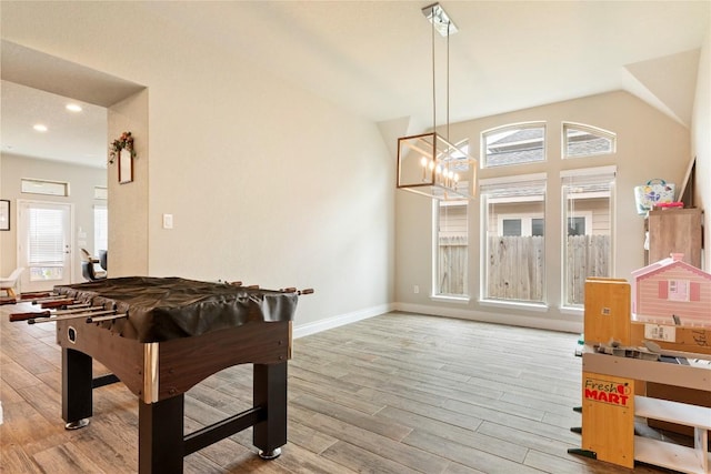 3105 High Meadow St, Seguin, TX 78155 - rec room featuring wood finished floors, a chandelier, baseboards, vaulted ceiling, and recessed lighting