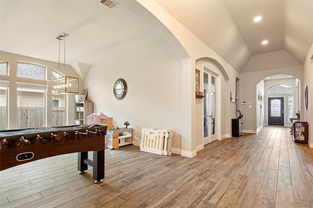 3105 High Meadow St, Seguin, TX 78155 - game room with arched walkways, vaulted ceiling, wood finished floors, baseboards, and a chandelier