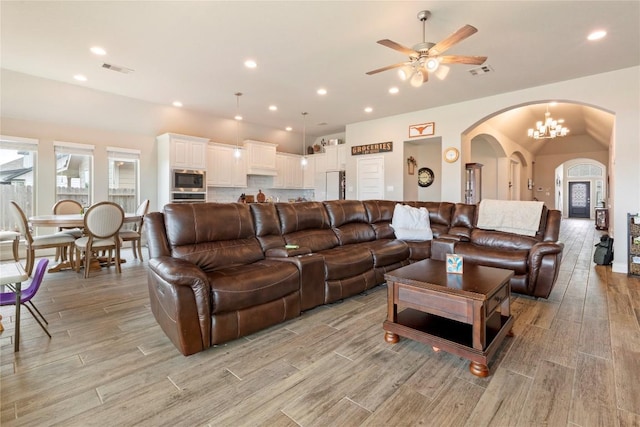 3105 High Meadow St, Seguin, TX 78155 - living area with light wood-style floors, arched walkways, ceiling fan, plenty of natural light, and recessed lighting