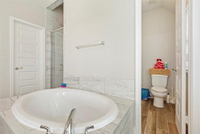 3105 High Meadow St, Seguin, TX 78155 - full bathroom with a garden tub, a shower stall, toilet, wood finished floors, and vaulted ceiling