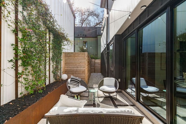 view of patio featuring fence