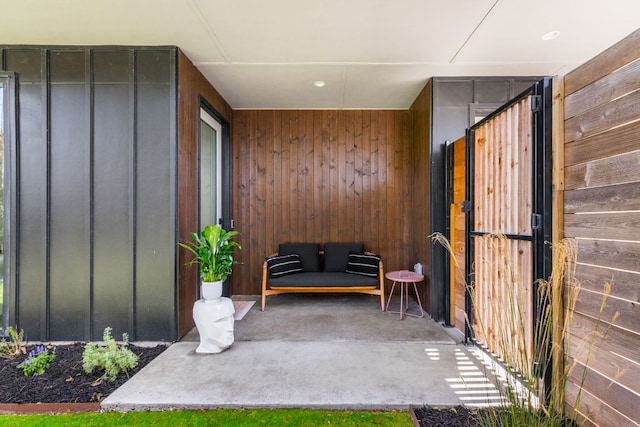 exterior space with wooden walls and carpet