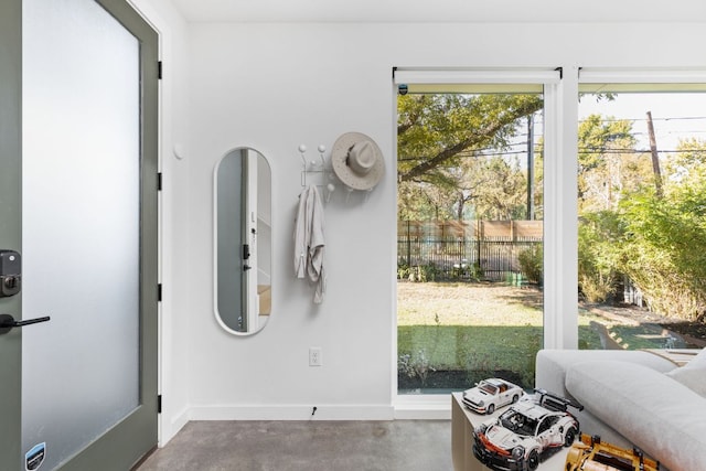 doorway to outside with concrete floors