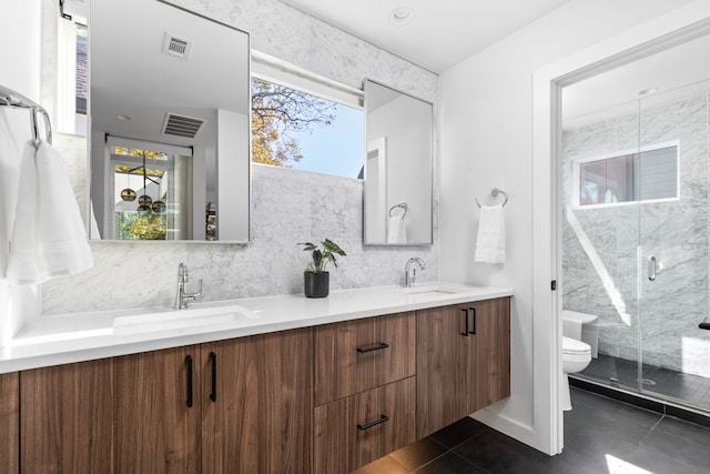bathroom with tile patterned flooring, a shower stall, toilet, and visible vents