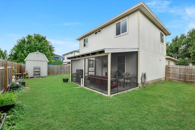 rear view of property with a fenced backyard, a lawn, a sunroom, and a storage shed