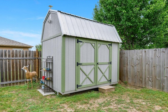 view of shed featuring a fenced backyard
