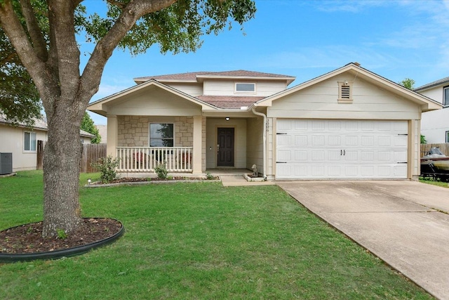 traditional-style home featuring central AC, a front lawn, a garage, a porch, and concrete driveway