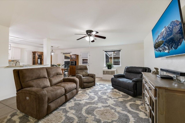 living room featuring ceiling fan and light tile patterned flooring