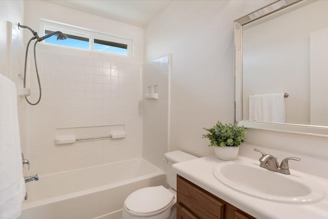 bathroom with toilet, shower / tub combination, and vanity
