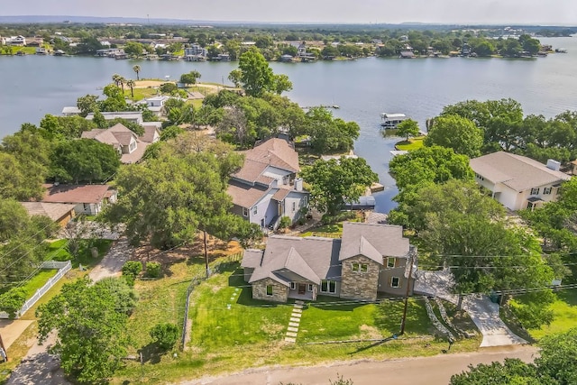 birds eye view of property featuring a water view and a residential view