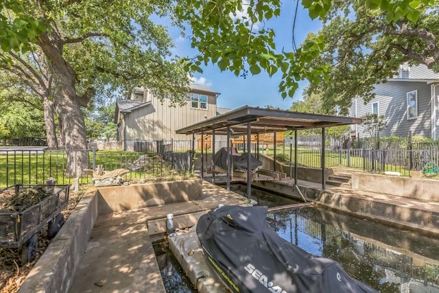 view of dock with a fenced backyard