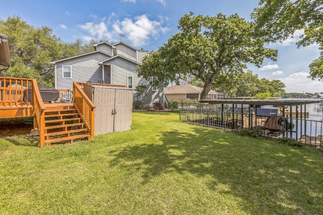 view of yard featuring stairs, fence, and a wooden deck