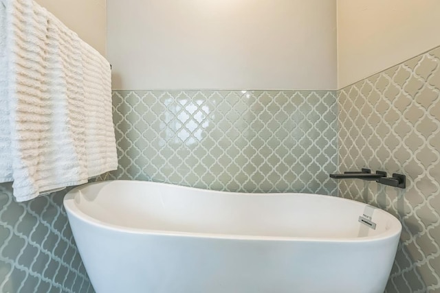 bathroom with a freestanding tub