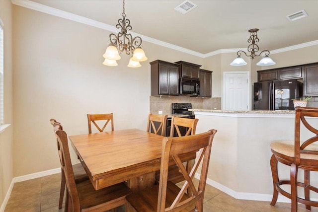 dining area with a chandelier, visible vents, ornamental molding, and light tile patterned floors
