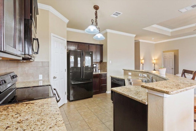 kitchen with dark brown cabinetry, visible vents, a sink, and black appliances