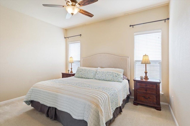 bedroom with carpet floors, baseboards, and ceiling fan