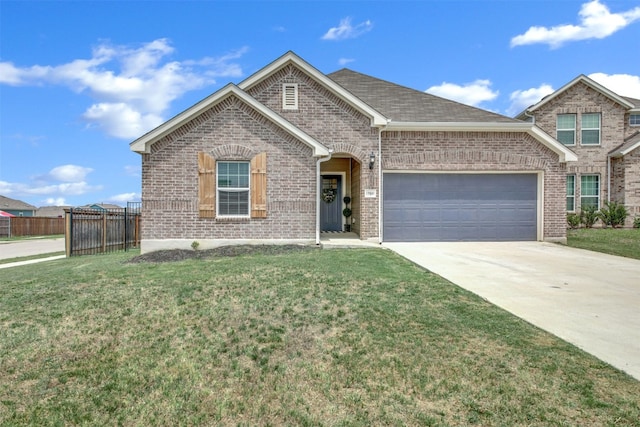 view of front of house with brick siding, fence, a front lawn, and a garage