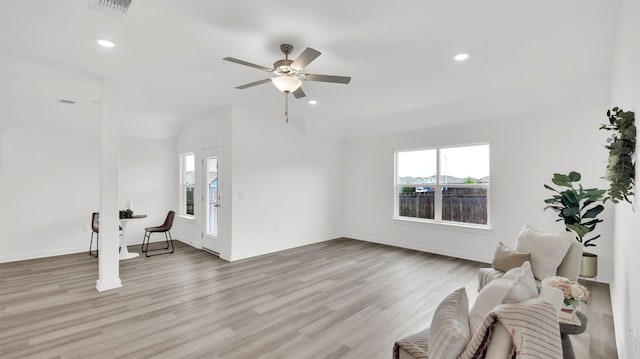 unfurnished living room featuring a ceiling fan, recessed lighting, wood finished floors, and visible vents