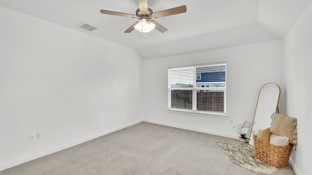 empty room with visible vents, carpet flooring, baseboards, and ceiling fan