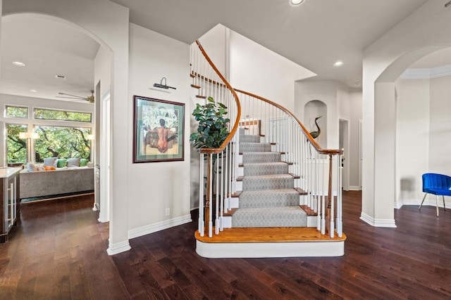 5705 Puccoon Cv, Austin, TX 78759 - stairway with arched walkways, wood-type flooring, baseboards, a ceiling fan, and recessed lighting