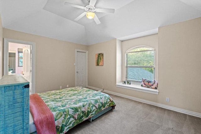 5705 Puccoon Cv, Austin, TX 78759 - carpeted bedroom featuring baseboards, lofted ceiling, and ceiling fan