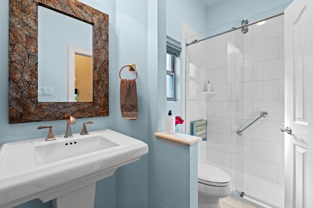 5705 Puccoon Cv, Austin, TX 78759 - bathroom with toilet, a stall shower, and a sink