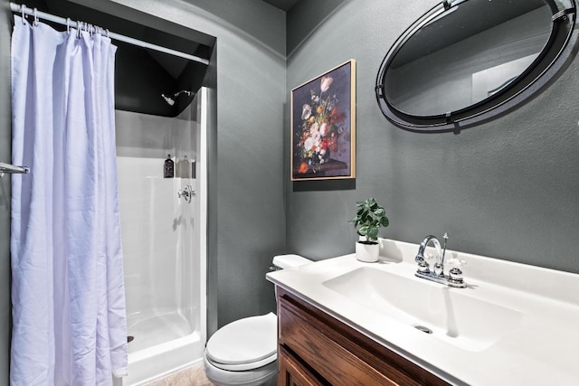 5705 Puccoon Cv, Austin, TX 78759 - bathroom featuring a shower stall, a textured wall, toilet, and vanity