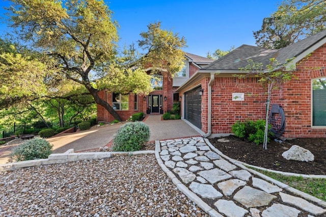 5705 Puccoon Cv, Austin, TX 78759 - view of front of property with brick siding, concrete driveway, a garage, and roof with shingles