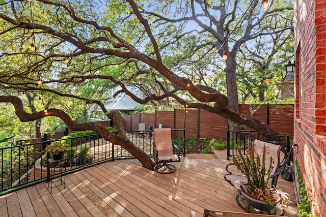 5705 Puccoon Cv, Austin, TX 78759 - wooden terrace featuring outdoor dining area and a fenced backyard