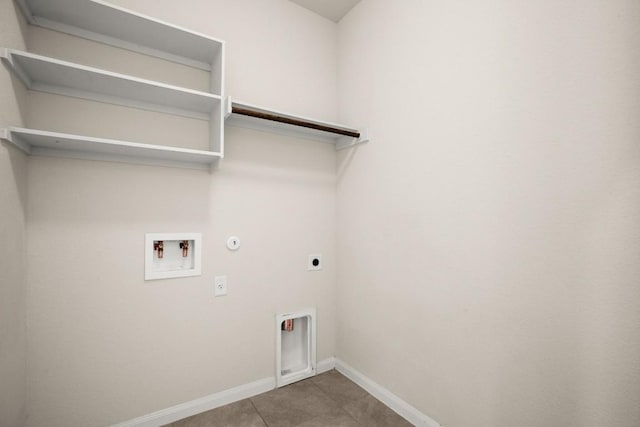 washroom with washer hookup, hookup for an electric dryer, laundry area, hookup for a gas dryer, and baseboards