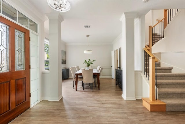 2045 Saint Andrews Dr, Round Rock, TX 78664 - foyer entrance with stairs, light wood-style floors, ornamental molding, and a chandelier