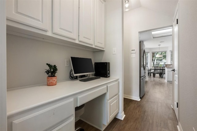 2045 Saint Andrews Dr, Round Rock, TX 78664 - office featuring built in desk and dark wood finished floors