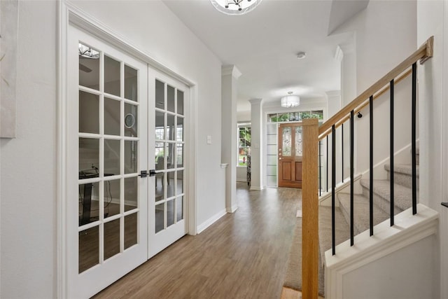 2045 Saint Andrews Dr, Round Rock, TX 78664 - foyer with wood finished floors, french doors, and stairway