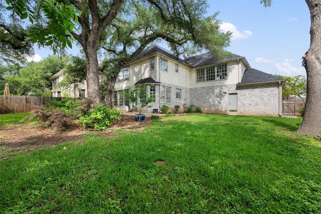 2045 Saint Andrews Dr, Round Rock, TX 78664 - rear view of house featuring brick siding