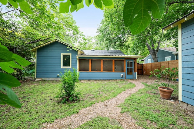 1516 Madison Ave, Austin, TX 78757 - rear view of house featuring a sunroom