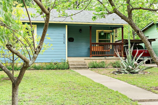1516 Madison Ave, Austin, TX 78757 - bungalow featuring roof with shingles, covered porch, and a front lawn