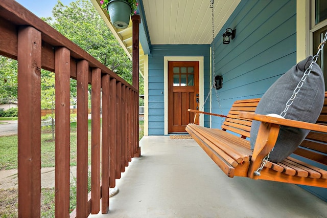 property entrance with covered porch