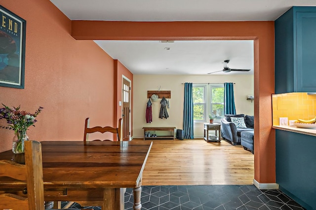 1516 Madison Ave, Austin, TX 78757 - dining area with dark tile patterned flooring, a ceiling fan, and baseboards