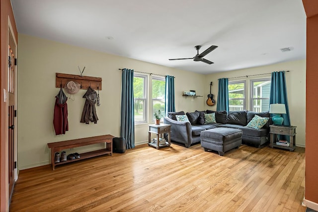 1516 Madison Ave, Austin, TX 78757 - living area with light wood-style floors, ceiling fan, and baseboards
