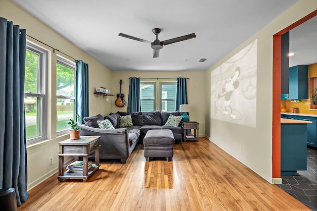 1516 Madison Ave, Austin, TX 78757 - living area with a ceiling fan, wood finished floors, and baseboards