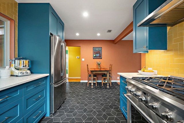 1516 Madison Ave, Austin, TX 78757 - kitchen featuring wall chimney range hood, appliances with stainless steel finishes, blue cabinetry, light countertops, and recessed lighting
