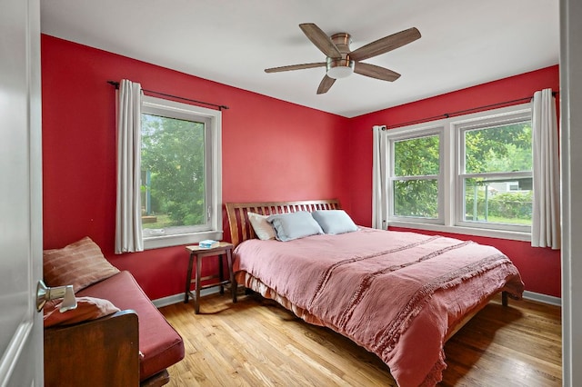 1516 Madison Ave, Austin, TX 78757 - bedroom featuring wood finished floors, baseboards, and a ceiling fan