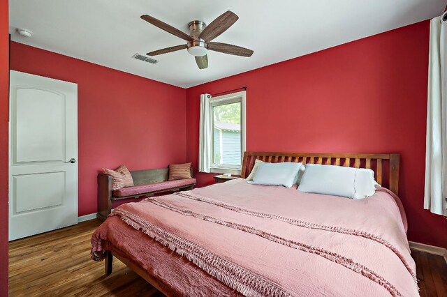 1516 Madison Ave, Austin, TX 78757 - bedroom featuring wood finished floors, baseboards, and ceiling fan