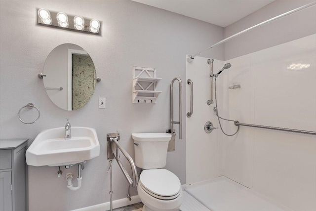 full bathroom with toilet, walk in shower, and a sink