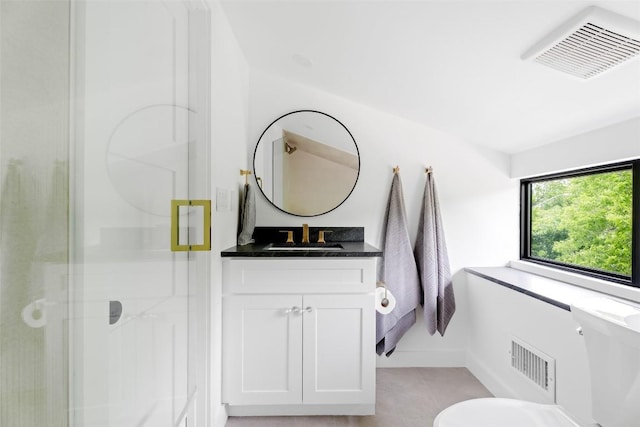 bathroom with vanity, tile patterned floors, a shower stall, and visible vents