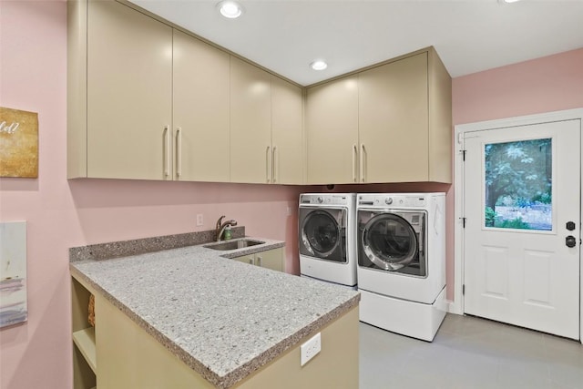clothes washing area featuring recessed lighting, a sink, cabinet space, and washer and dryer